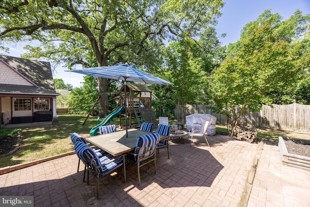 100 W Maple Ave, Merchantville, NJ 08109 - fenced backyard featuring a patio, a playground, area for grilling, and outdoor dining area