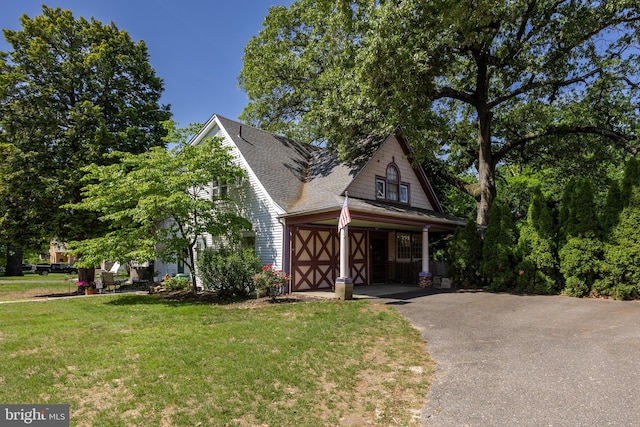 100 W Maple Ave, Merchantville, NJ 08109 - view of front of home featuring asphalt driveway, a front yard, a garage, and roof with shingles