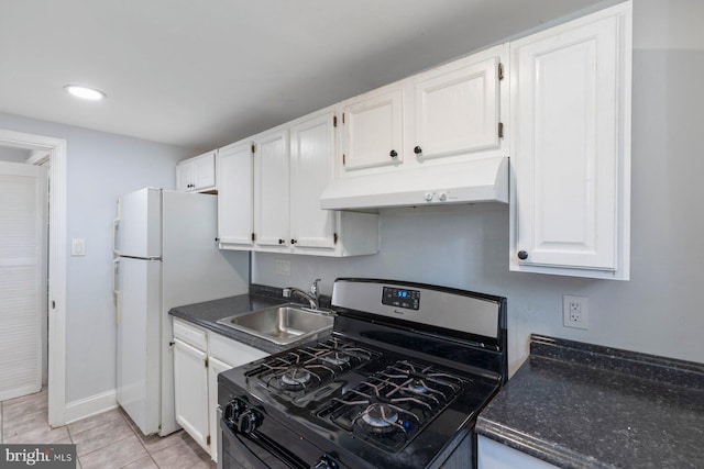 kitchen with under cabinet range hood, gas range, a sink, white cabinets, and recessed lighting