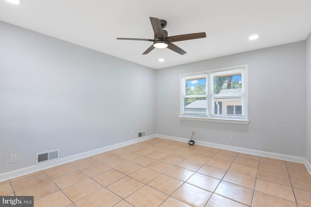 spare room featuring a ceiling fan, recessed lighting, baseboards, and light tile patterned flooring
