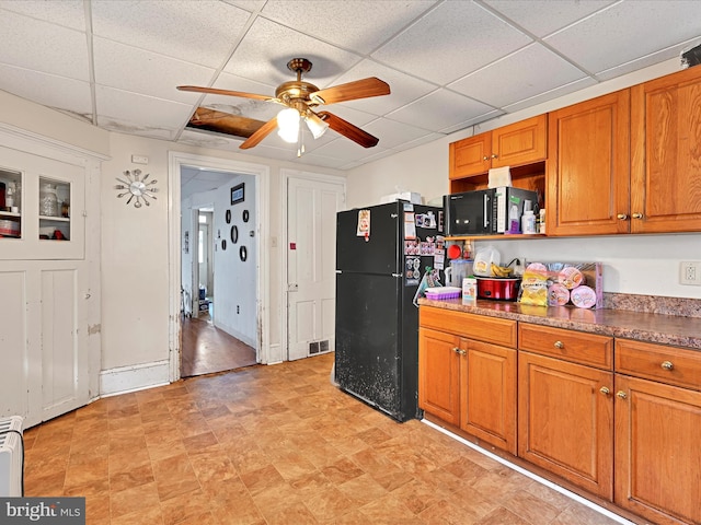 328 W 2nd St, Birdsboro, PA 19508 - kitchen with freestanding refrigerator, ceiling fan, brown cabinets, and a paneled ceiling