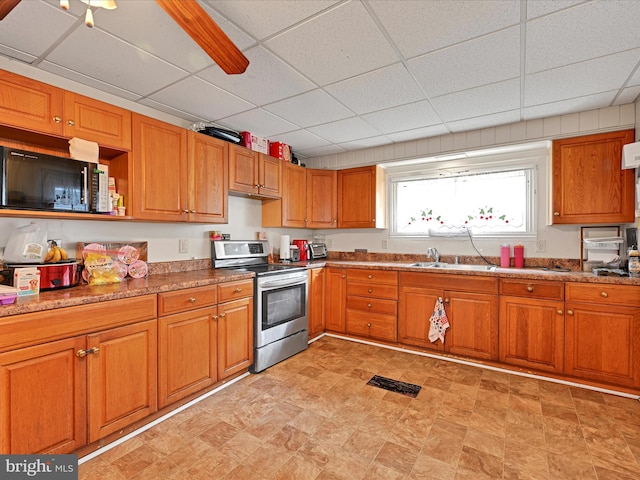 328 W 2nd St, Birdsboro, PA 19508 - kitchen featuring electric stove, brown cabinets, a paneled ceiling, and a sink
