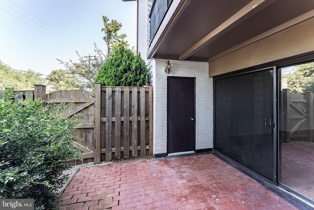 2856 Dover Ln Unit 103, Falls Church, VA 22042 - property entrance with a gate, brick siding, and a patio area