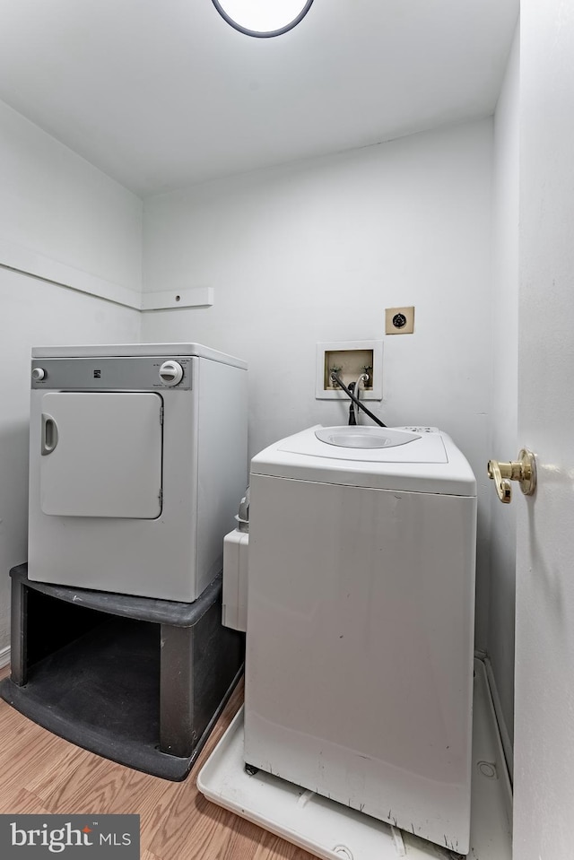 2856 Dover Ln Unit 103, Falls Church, VA 22042 - laundry room featuring washer / dryer and light wood-type flooring