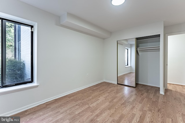 2856 Dover Ln Unit 103, Falls Church, VA 22042 - unfurnished bedroom with light wood-type flooring and a closet