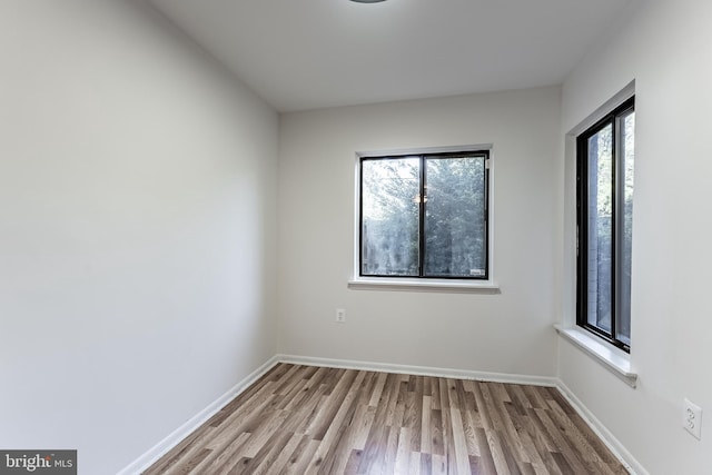 2856 Dover Ln Unit 103, Falls Church, VA 22042 - empty room featuring wood finished floors and baseboards