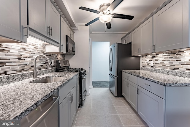 2856 Dover Ln Unit 103, Falls Church, VA 22042 - kitchen with stainless steel appliances, a ceiling fan, gray cabinets, and tasteful backsplash