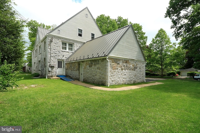 441-445 Ridge Ave, State College, PA 16803 - rear view of property featuring stone siding, a standing seam roof, a lawn, and metal roof