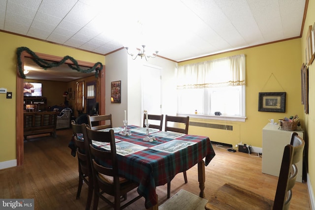 441-445 Ridge Ave, State College, PA 16803 - dining room featuring radiator heating unit, crown molding, a chandelier, and wood finished floors