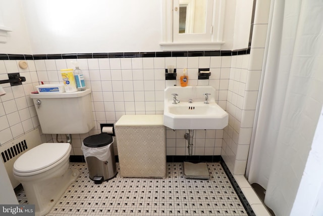441-445 Ridge Ave, State College, PA 16803 - full bath with tile walls, toilet, a sink, a wainscoted wall, and a shower with shower curtain