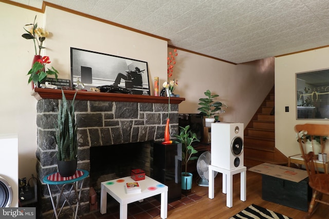 441-445 Ridge Ave, State College, PA 16803 - living room featuring wood finished floors, crown molding, stairs, and a stone fireplace