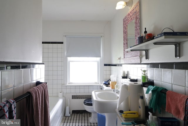 441-445 Ridge Ave, State College, PA 16803 - full bath with tile walls, radiator heating unit, toilet, and a tub