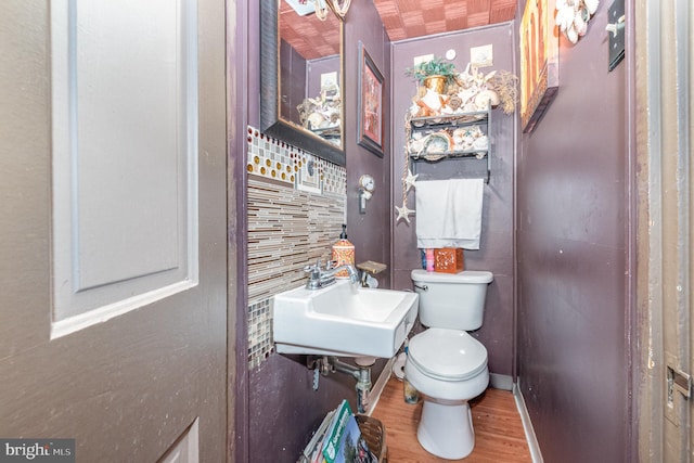 135 Lucknow Rd, Harrisburg, PA 17110 - bathroom with toilet, a sink, and wood finished floors
