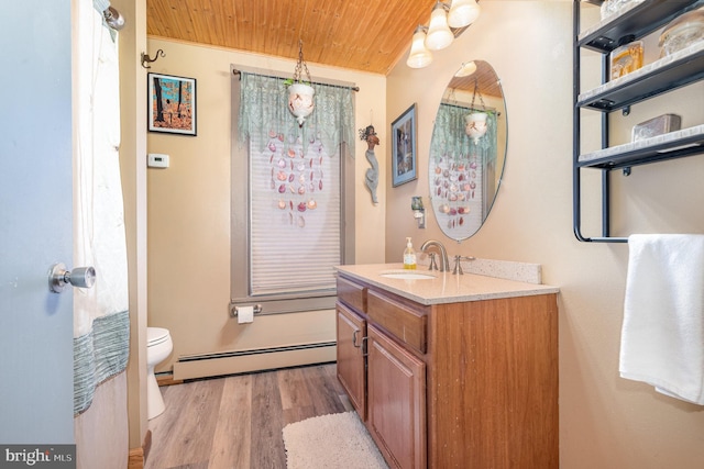 135 Lucknow Rd, Harrisburg, PA 17110 - bathroom featuring baseboard heating, wooden ceiling, vanity, toilet, and wood finished floors