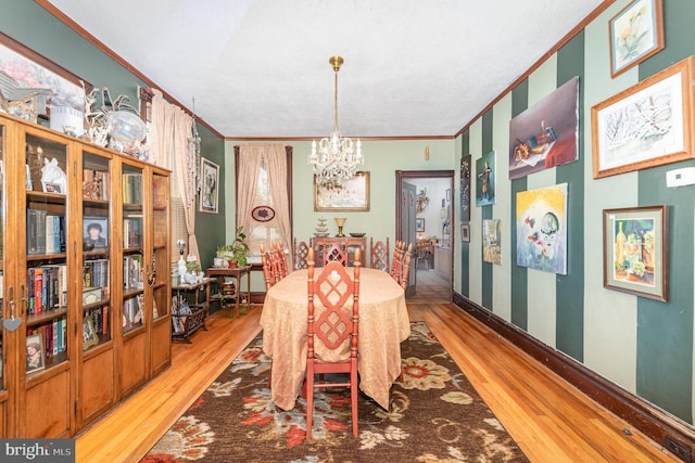 135 Lucknow Rd, Harrisburg, PA 17110 - dining room featuring a chandelier, ornamental molding, light wood-type flooring, and baseboards