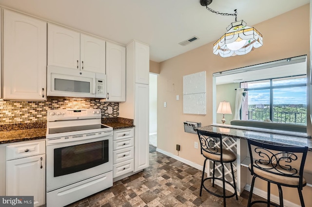 1 Smeton Pl Unit 1004, Towson, MD 21204 - kitchen with white appliances, tasteful backsplash, white cabinets, baseboards, and stone finish flooring