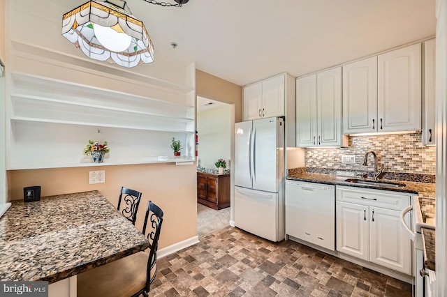 1 Smeton Pl Unit 1004, Towson, MD 21204 - kitchen with white appliances, a sink, white cabinets, backsplash, and stone finish flooring