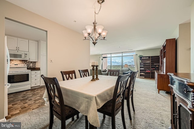 1 Smeton Pl Unit 1004, Towson, MD 21204 - dining area with a chandelier and a wall of windows