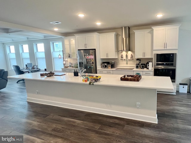 10407 Ratcliffe Trl, Manassas, VA 20110 - kitchen with wall chimney exhaust hood, stainless steel appliances, a large island, white cabinetry, and light countertops