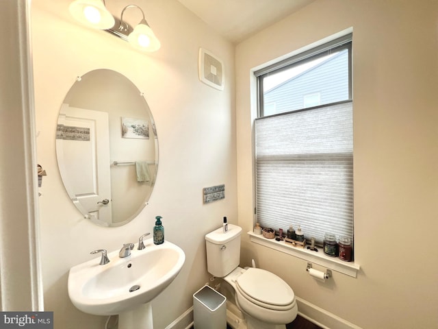 10407 Ratcliffe Trl, Manassas, VA 20110 - bathroom featuring a sink, toilet, and baseboards