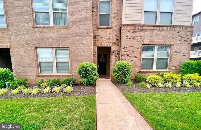 10407 Ratcliffe Trl, Manassas, VA 20110 - property entrance with brick siding and a lawn