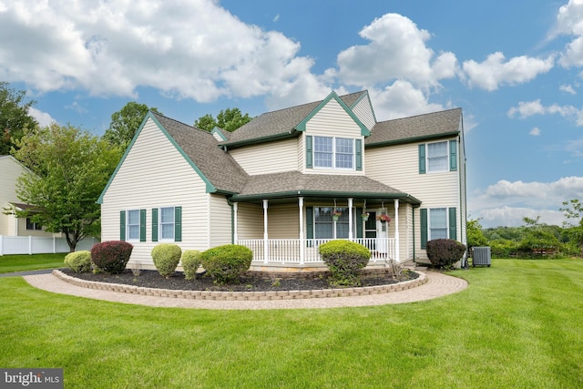 111 Ramblewood Dr, Glenmoore, PA 19343 - view of front of home featuring covered porch, cooling unit, a front lawn, and roof with shingles