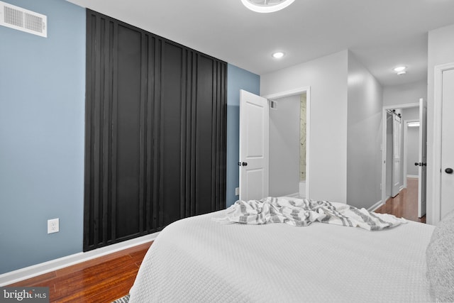 510 N Glover St, Baltimore, MD 21205 - bedroom featuring dark wood-type flooring, recessed lighting, and baseboards