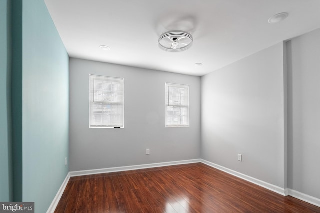 510 N Glover St, Baltimore, MD 21205 - spare room featuring dark wood-type flooring and baseboards
