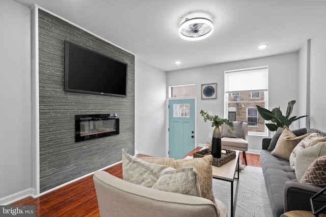 510 N Glover St, Baltimore, MD 21205 - living area featuring a large fireplace, wood finished floors, baseboards, and recessed lighting