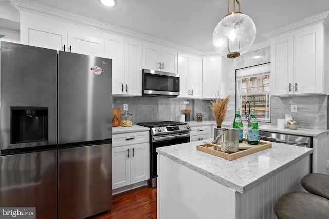 510 N Glover St, Baltimore, MD 21205 - kitchen featuring stainless steel appliances, dark wood-type flooring, white cabinetry, a center island, and recessed lighting