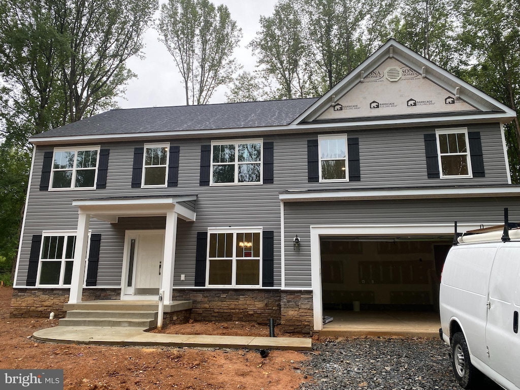 3 Rosedale Dr, Stafford, VA 22556 - view of front facade with a garage, stone siding, and driveway