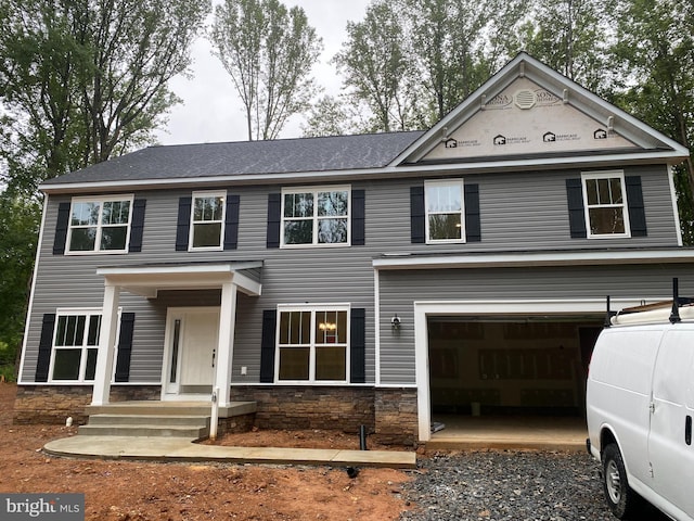 3 Rosedale Dr, Stafford, VA 22556 - view of front facade with a garage, stone siding, and driveway