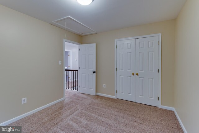1451 Apple, Saint Leonard, MD 20685 - unfurnished bedroom featuring attic access, carpet flooring, a closet, and baseboards