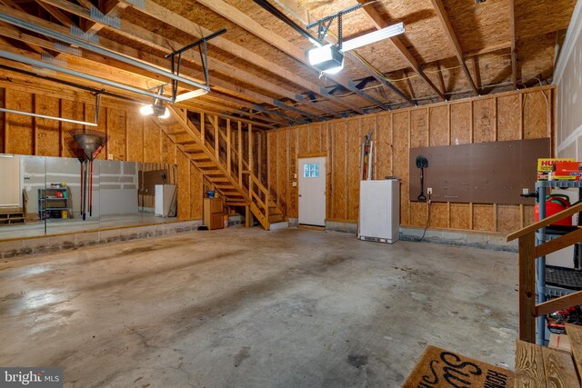 1451 Apple, Saint Leonard, MD 20685 - garage with a garage door opener and freestanding refrigerator
