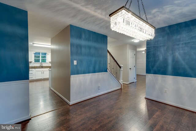 1451 Apple, Saint Leonard, MD 20685 - spare room featuring a chandelier, hardwood / wood-style flooring, baseboards, and stairs