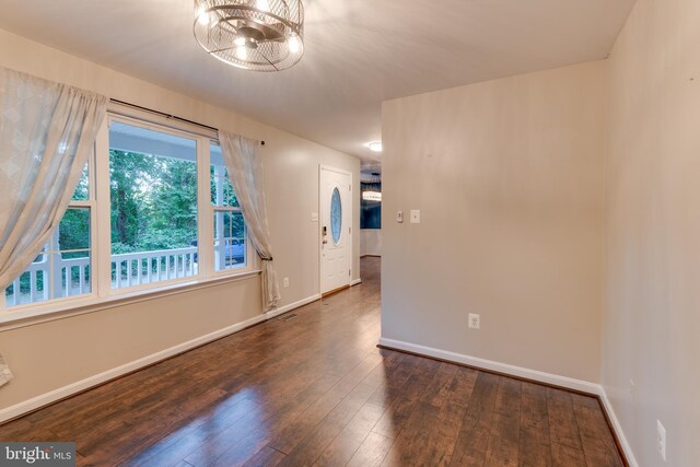 1451 Apple, Saint Leonard, MD 20685 - spare room featuring dark wood finished floors, baseboards, and a chandelier