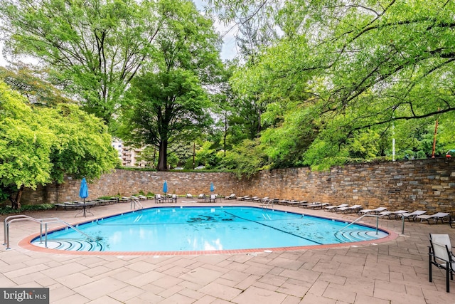4000 Tunlaw Rd NW Unit 603, Washington, DC 20007 - community pool with a patio and view of scattered trees