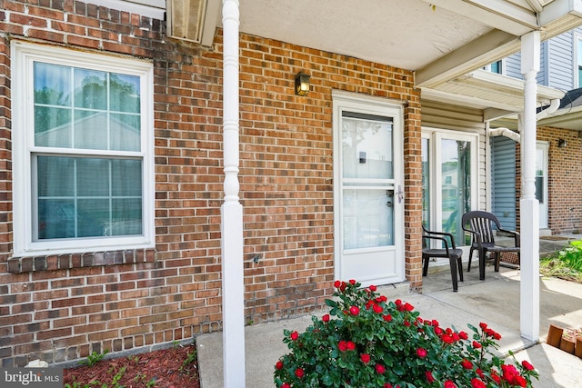 205 Highland Blvd, New Castle, DE 19720 - property entrance featuring a porch and brick siding