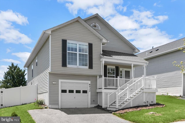 view of front of home with covered porch, a garage, stairs, driveway, and a shingled roof
