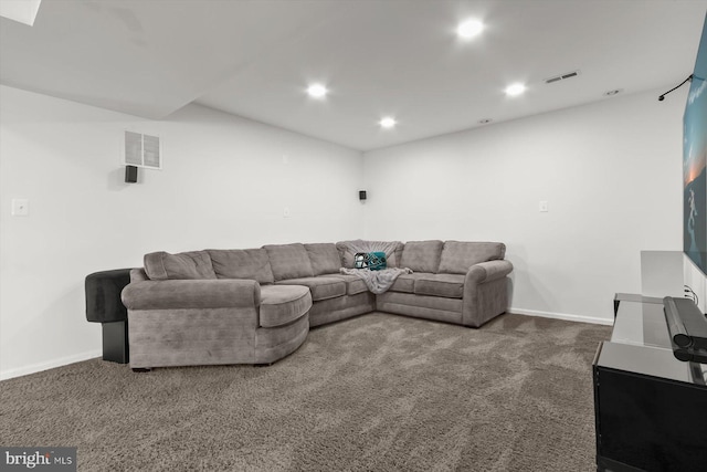 carpeted living area featuring recessed lighting and baseboards