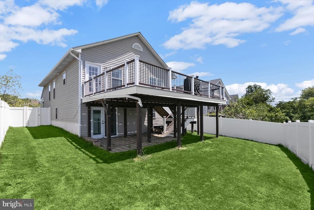 rear view of property featuring a deck and stairs