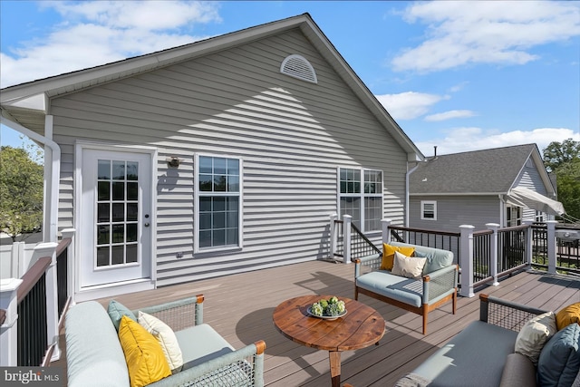 wooden deck featuring an outdoor hangout area