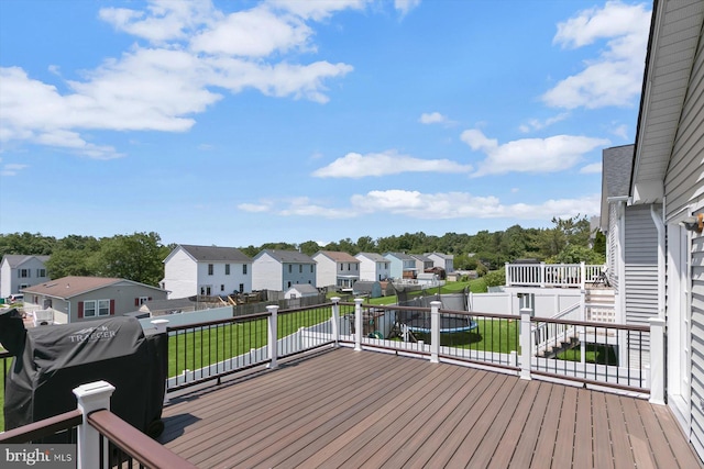 wooden deck featuring a residential view