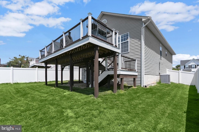 rear view of property featuring a deck, stairway, and central AC unit