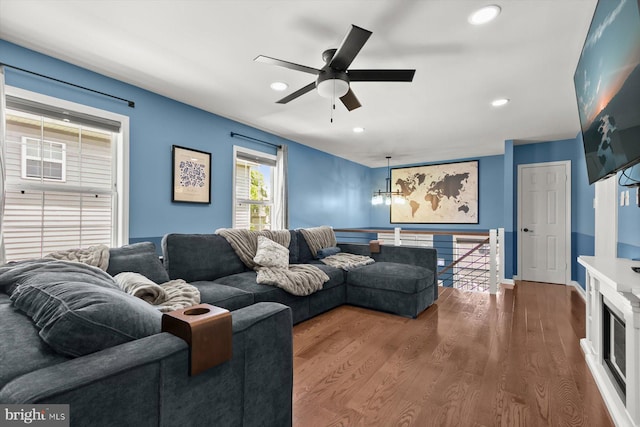living area featuring recessed lighting, a ceiling fan, and wood finished floors