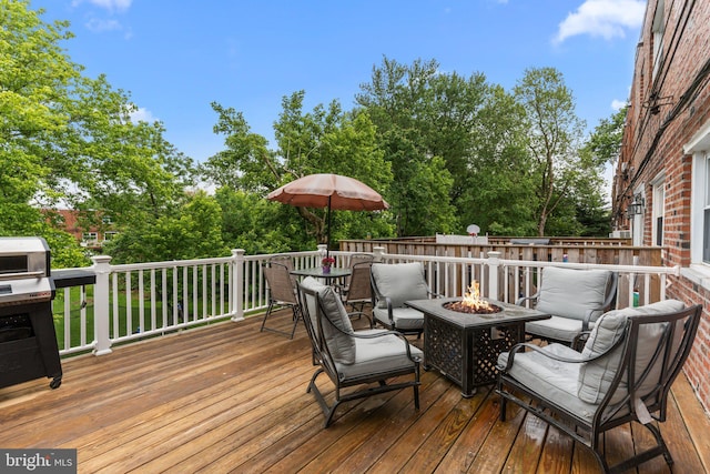 12413 Barbary Rd, Philadelphia, PA 19154 - deck with an outdoor fire pit, view of wooded area, and outdoor dining space