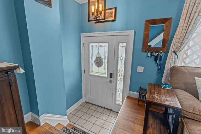 12413 Barbary Rd, Philadelphia, PA 19154 - entrance foyer with baseboards, a chandelier, and light tile patterned floors