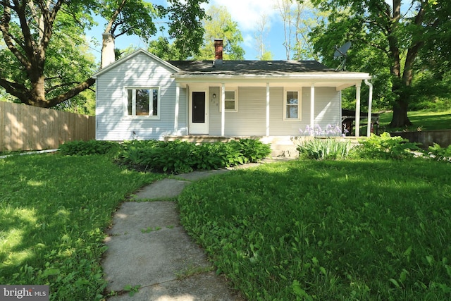 250 E Main St, Millheim, PA 16854 - view of front of property featuring a chimney and a porch