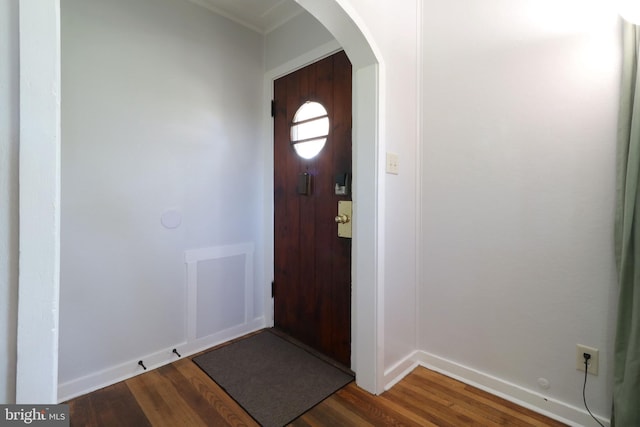 250 E Main St, Millheim, PA 16854 - foyer featuring arched walkways, dark wood finished floors, and baseboards
