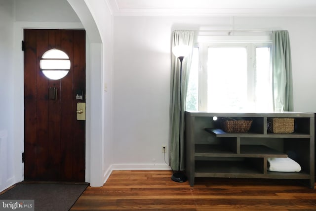250 E Main St, Millheim, PA 16854 - entrance foyer featuring arched walkways, wood finished floors, ornamental molding, and baseboards